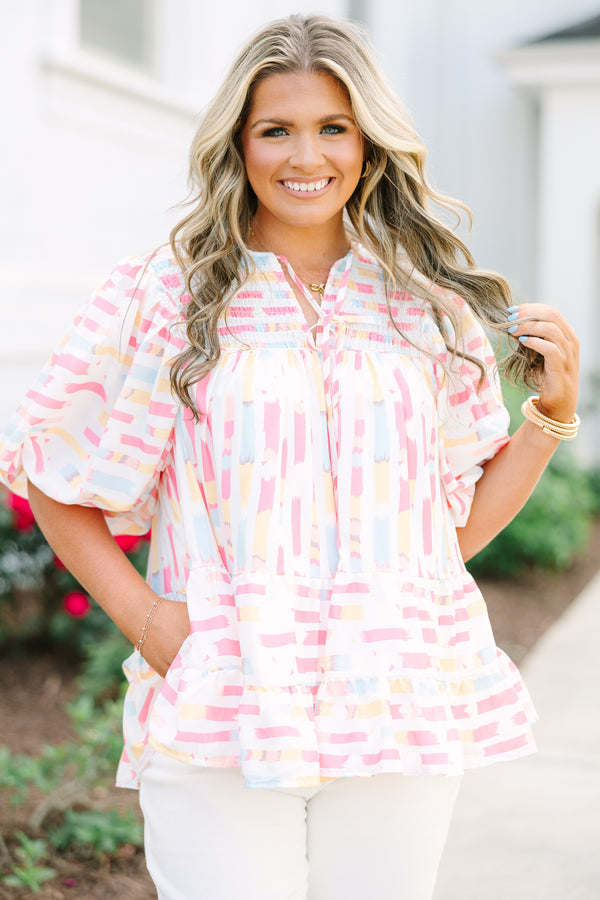 Chic Soul plus size clothing, flowy white top with multicolored abstract design with short bubble sleeves and a slight v-neckline as well as a smocked texture on the shoulder area 