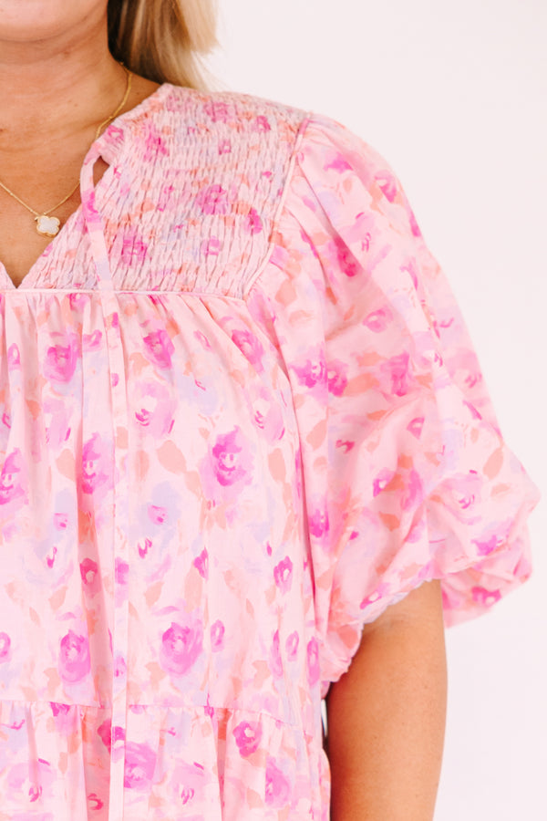 Chic Soul plus size clothing, pink floral flowy top with short bubble sleeves and a slight v-neckline as well as a smocked texture on the shoulder area 