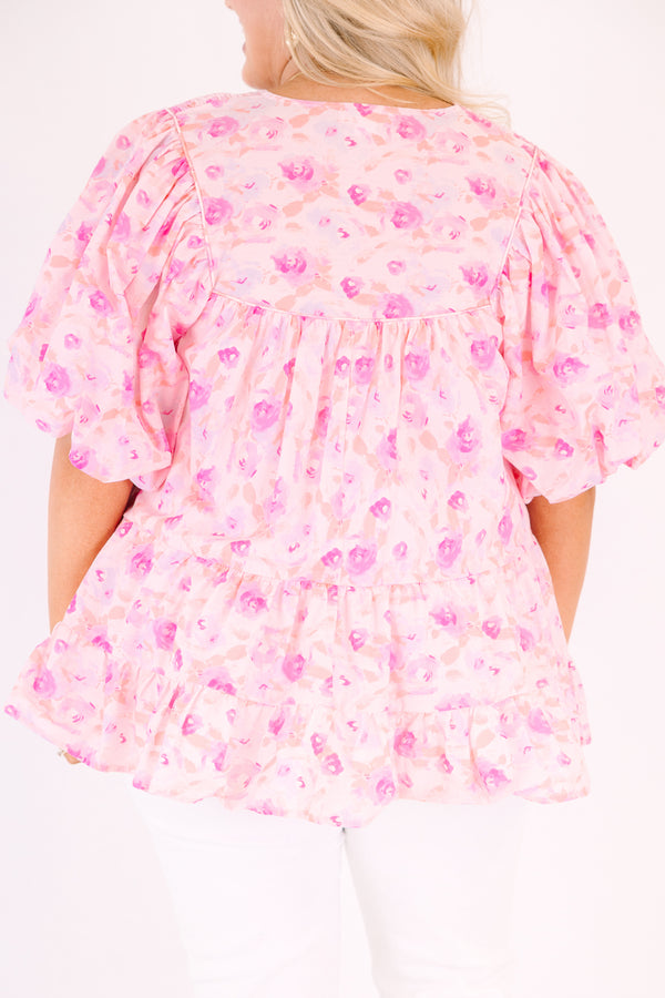 Chic Soul plus size clothing, pink floral flowy top with short bubble sleeves and a slight v-neckline as well as a smocked texture on the shoulder area 