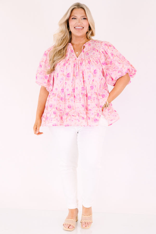 Chic Soul plus size clothing, pink floral flowy top with short bubble sleeves and a slight v-neckline as well as a smocked texture on the shoulder area 