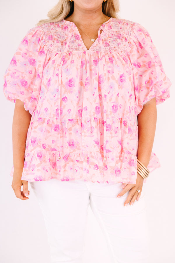 Chic Soul plus size clothing, pink floral flowy top with short bubble sleeves and a slight v-neckline as well as a smocked texture on the shoulder area 