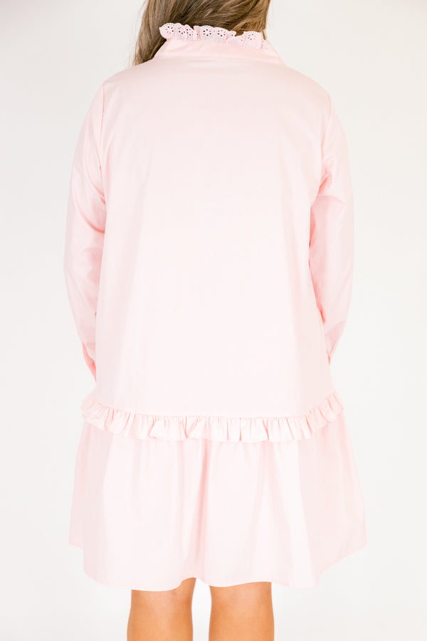 Chic Soul plus size clothing, pastel pink knee length long sleeve dress with a ruffle detail on the dress right above the knee as well as going down the v-neckline and buttons 