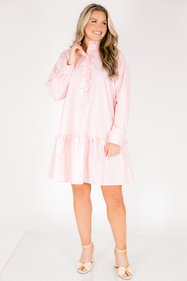 Chic Soul plus size clothing, pastel pink knee length long sleeve dress with a ruffle detail on the dress right above the knee as well as going down the v-neckline and buttons 