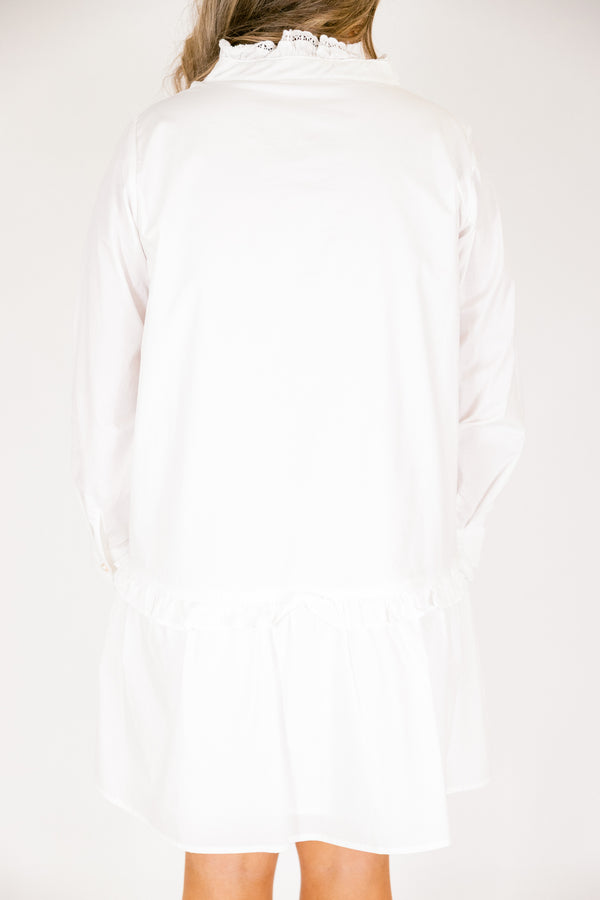 Chic Soul plus size clothing, white knee length dress with buttons going down to the chest as well as a lace ruffle detail on the collar and the button-up section 