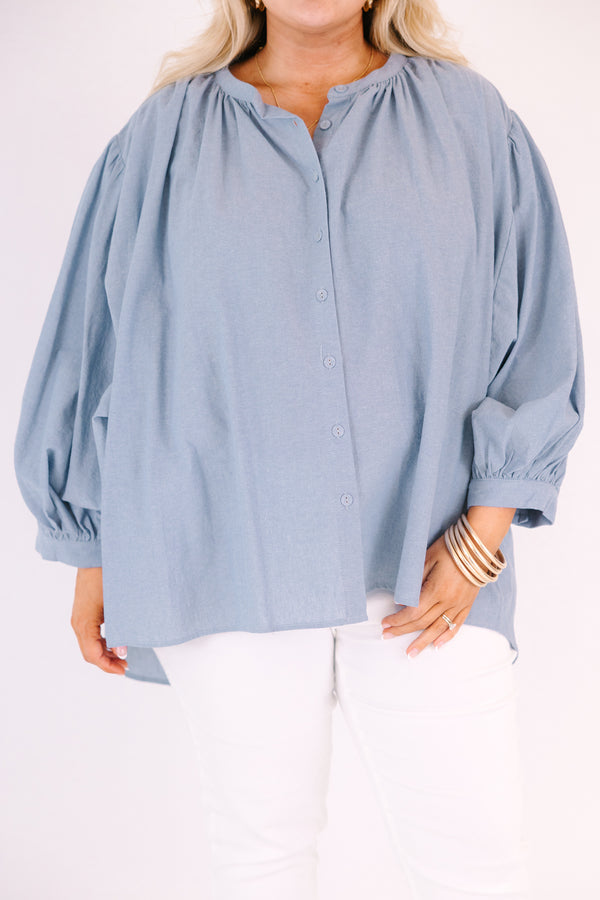 Chic soul plus size clothing, chambray button-up top with long sleeves that have cuffs at the end of each sleeve 
