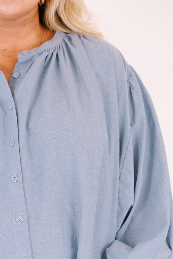 Chic soul plus size clothing, chambray button-up top with long sleeves that have cuffs at the end of each sleeve 
