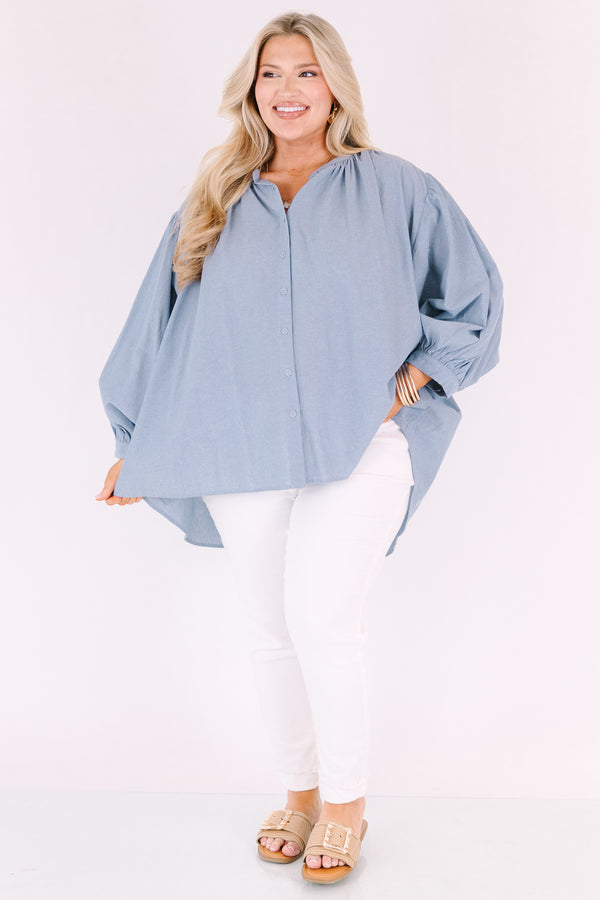 Chic soul plus size clothing, chambray button-up top with long sleeves that have cuffs at the end of each sleeve 

