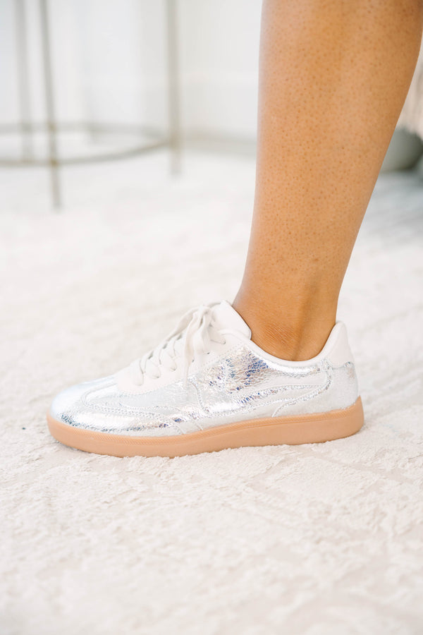 Plus Size silver metallic sneakers with white laces and a tan gum sole.