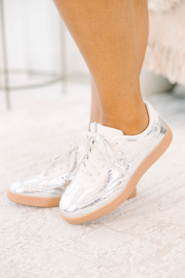 Plus Size silver metallic sneakers with white laces and a tan gum sole.