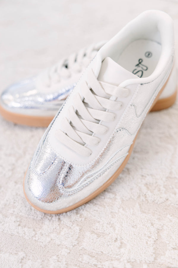 Plus Size silver metallic sneakers with white laces and a tan gum sole.