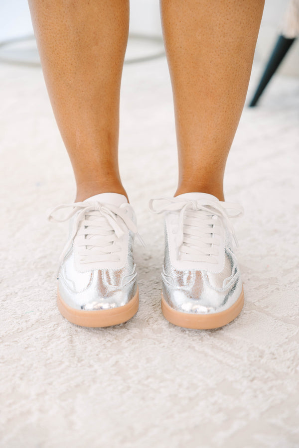 Plus Size silver metallic sneakers with white laces and a tan gum sole.