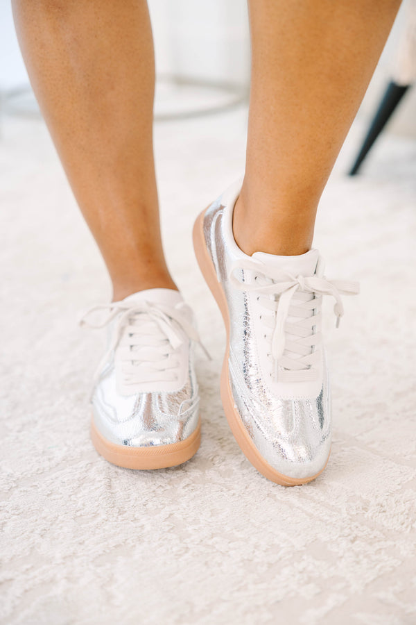 Plus Size silver metallic sneakers with white laces and a tan gum sole.