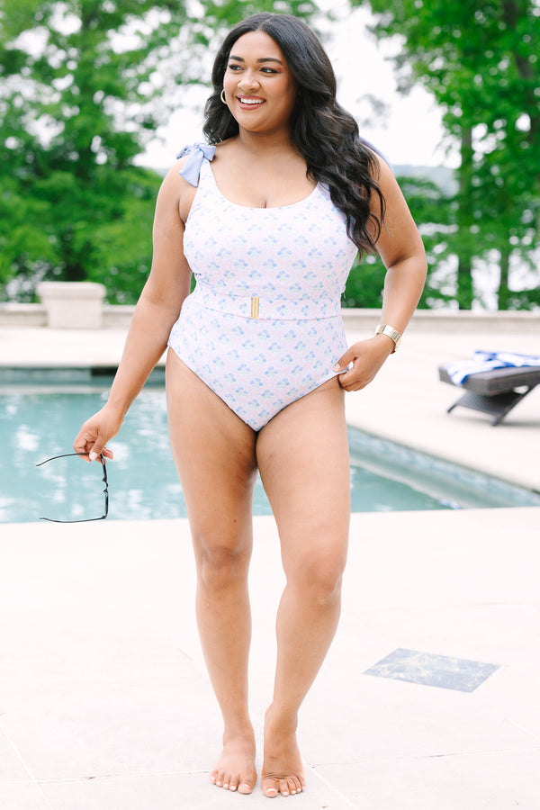 Chic Soul Plus Size Clothing, a blue floral print one-piece swimsuit with bows at the top of the tank style sleeves and a belt with a golden clasp