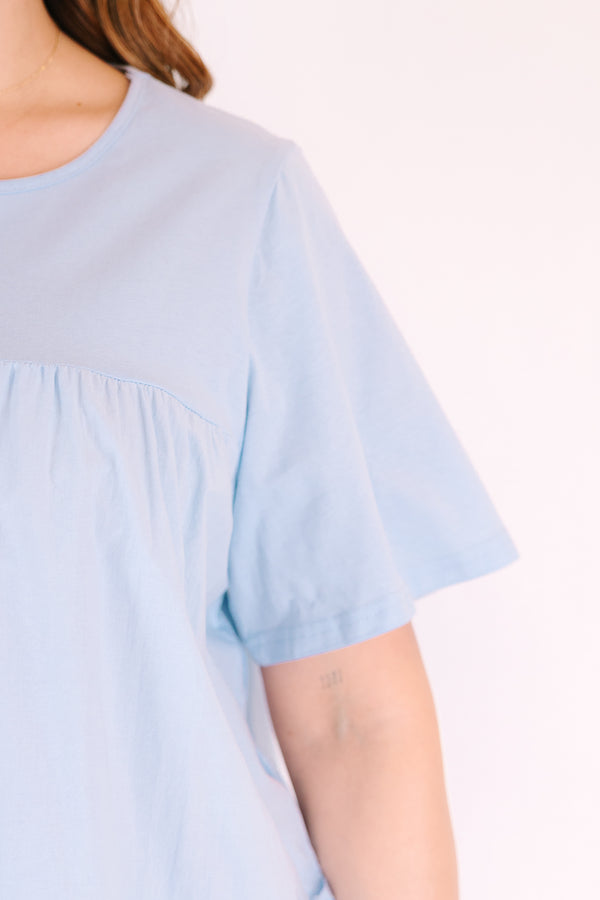 Chic Soul plus size clothing, light blue short sleeve crew neck baby doll top with 2 ruffle stripes around the bottom of the torso
