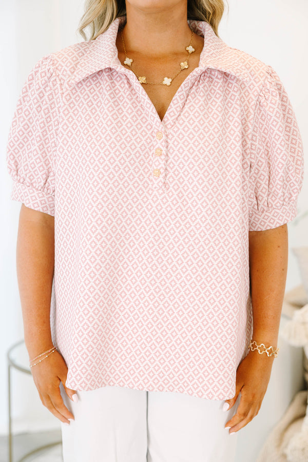 Plus Size pink and white geometric print top with puff sleeves, a collared neckline, and buttons.