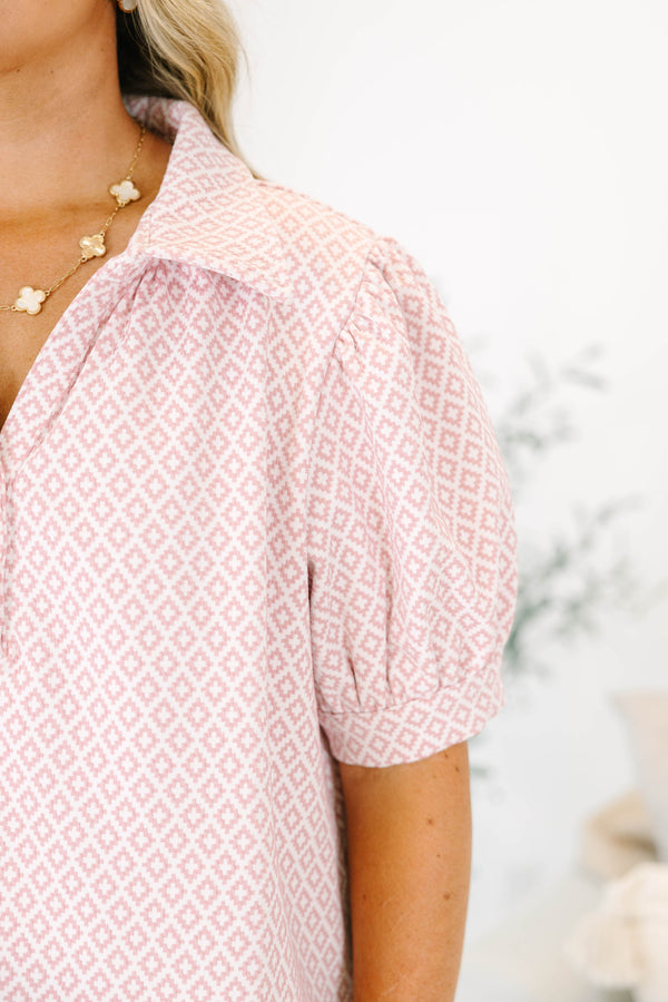 Plus Size pink and white geometric print top with puff sleeves, a collared neckline, and buttons.