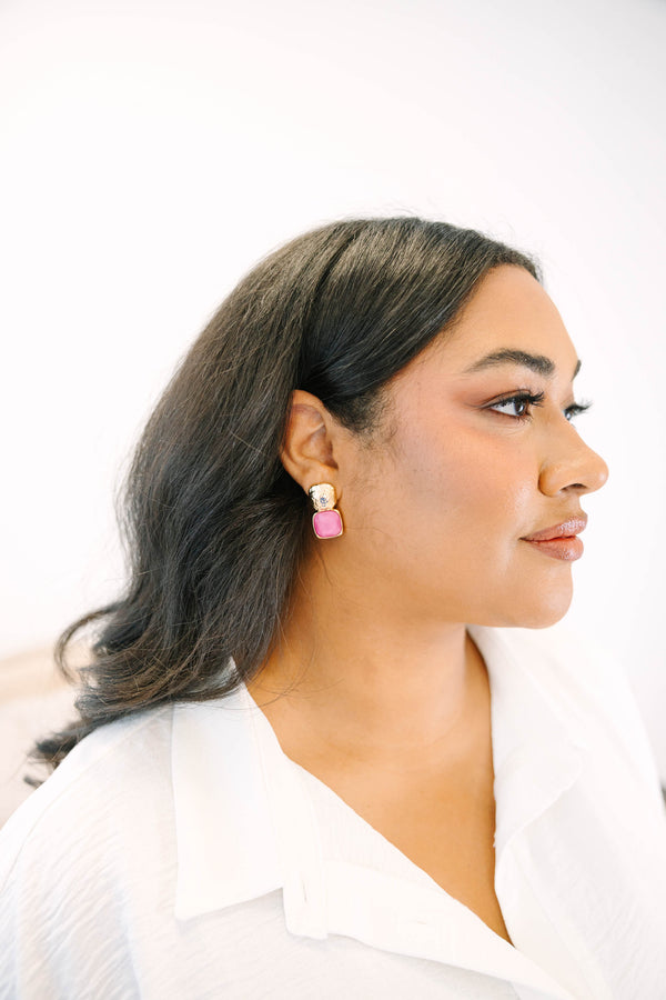 Plus Size gold-toned square stud earrings featuring textured metal and purple stone accents.