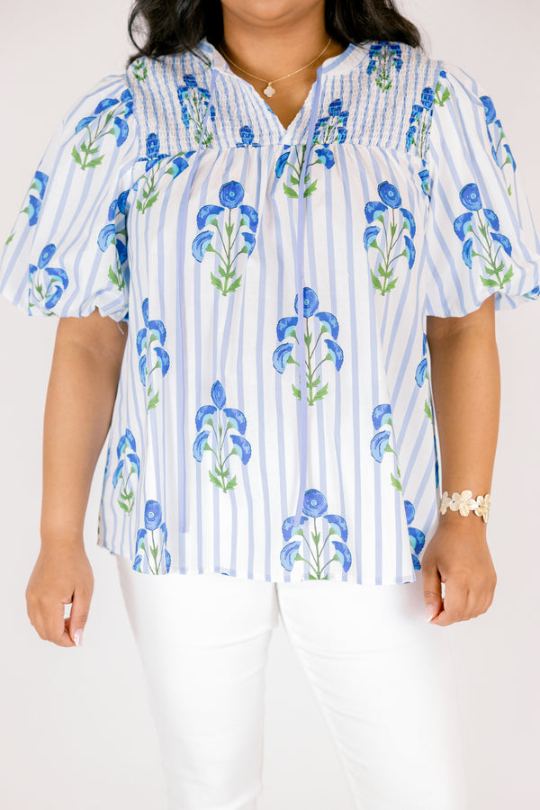 Chic Soul plus size clothing, blue striped top with bubble sleeves a slight v-neckline and a blue floral block print. 