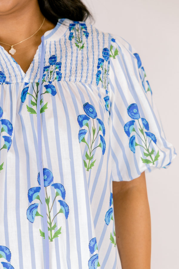 Chic Soul plus size clothing, blue striped top with bubble sleeves a slight v-neckline and a blue floral block print. 