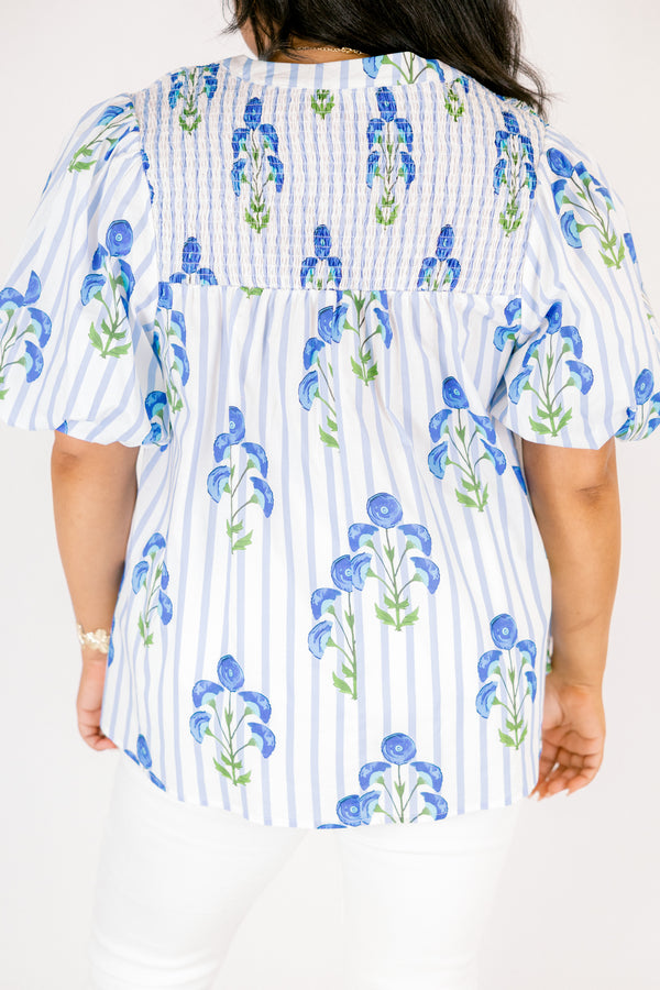 Chic Soul plus size clothing, blue striped top with bubble sleeves a slight v-neckline and a blue floral block print. 