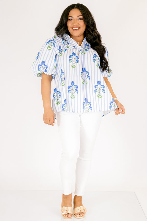 Chic Soul plus size clothing, blue striped top with bubble sleeves a slight v-neckline and a blue floral block print. 