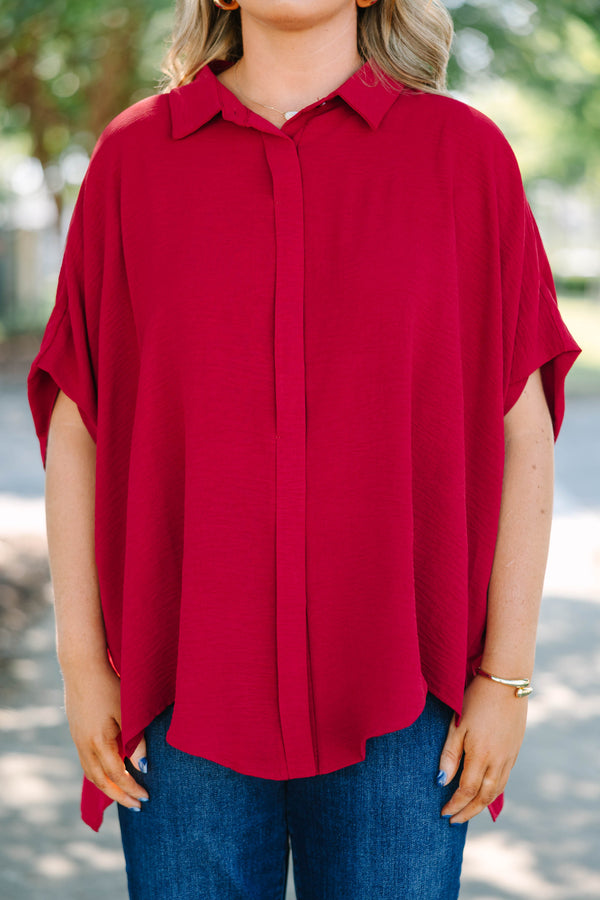 Plus size flowy wine red button-down top with a collared neck and drop shoulders.