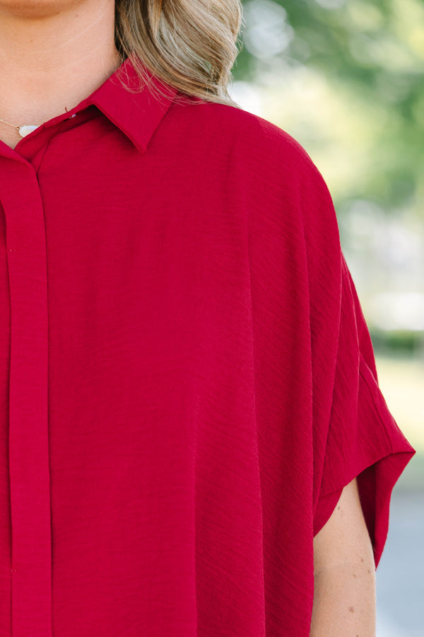 Plus size flowy wine red button-down top with a collared neck and drop shoulders.