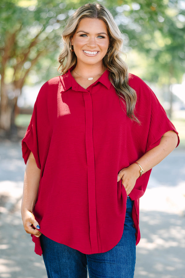 Plus size flowy wine red button-down top with a collared neck and drop shoulders.
