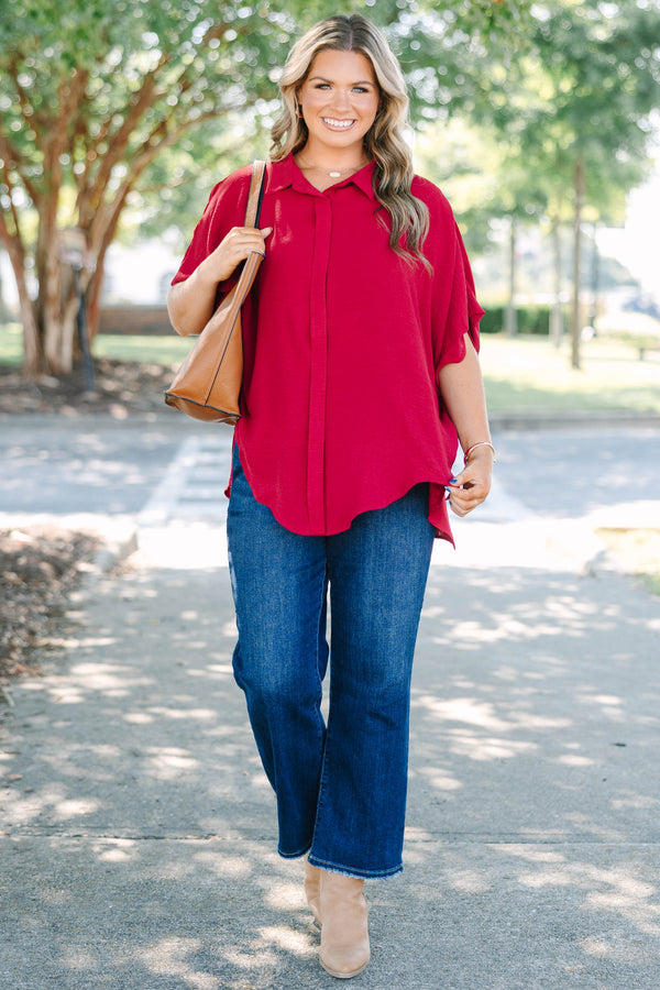 Plus size flowy wine red button-down top with a collared neck and drop shoulders.