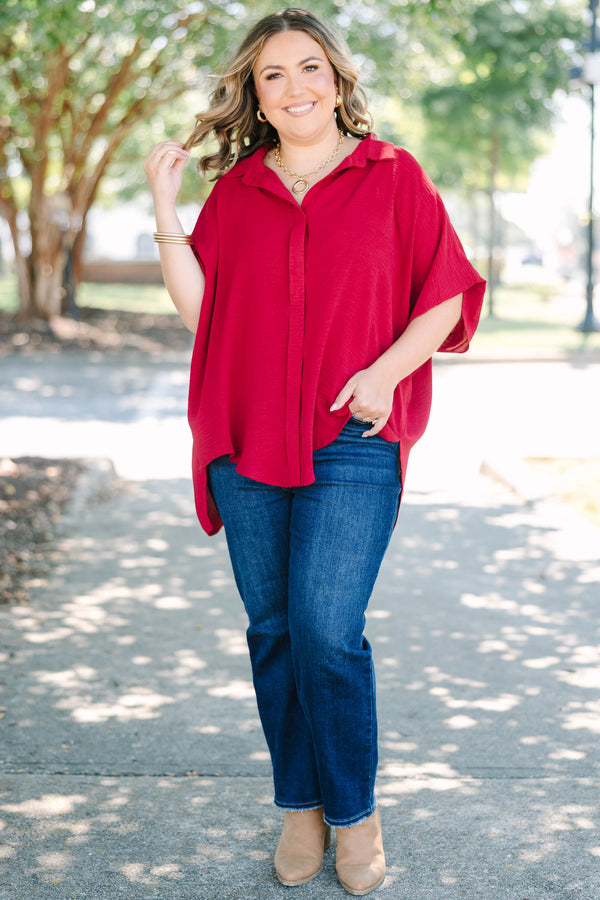 Plus size flowy wine red button-down top with a collared neck and drop shoulders.