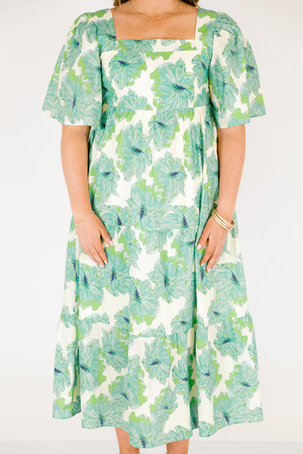 Chic Soul plus size clothing, green tiered maxi dress with short sleeves a square neckline and a green floral pattern throughout 
