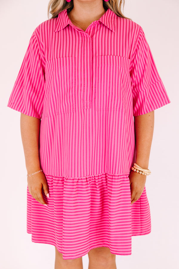 Chic Soul plus size clothing,  pink knee length dress with a ruffle detail on the bottom of the dress and buttons going down the middle of the dress to the bottom of the chest area as well has half sleeves and a dark pink striped pattern throughout 