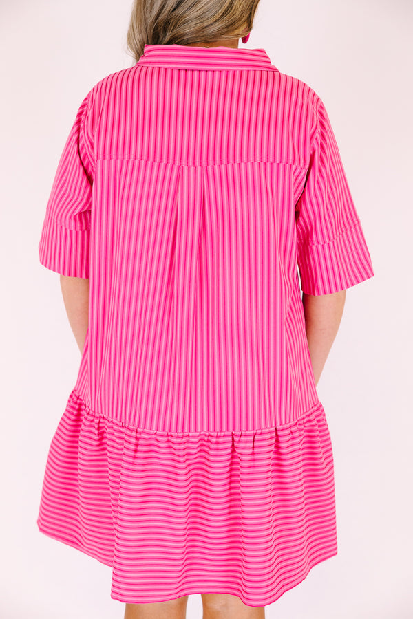 Chic Soul plus size clothing,  pink knee length dress with a ruffle detail on the bottom of the dress and buttons going down the middle of the dress to the bottom of the chest area as well has half sleeves and a dark pink striped pattern throughout 
