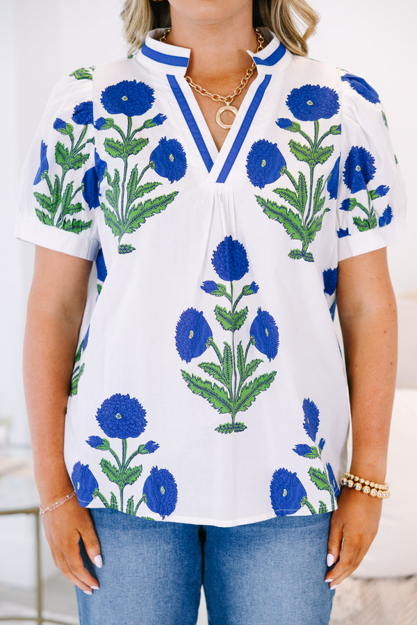 Plus Size white V-neck top with blue floral block print, puff sleeves, and blue trim.
