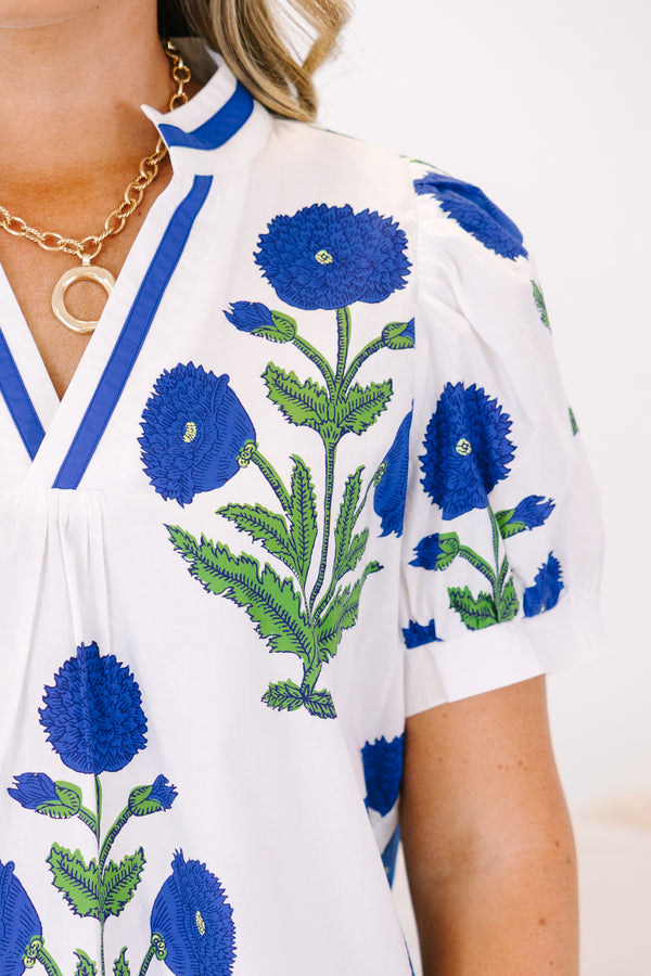 Plus Size white V-neck top with blue floral block print, puff sleeves, and blue trim.