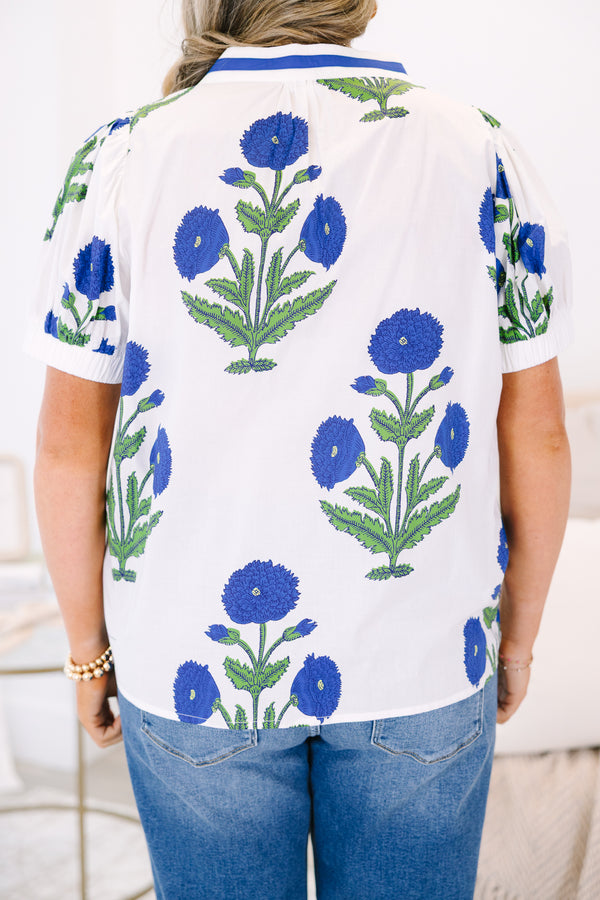 Plus Size white V-neck top with blue floral block print, puff sleeves, and blue trim.