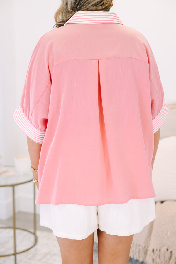 Plus Size pink v-neck top with striped trim on the collar and short sleeves.