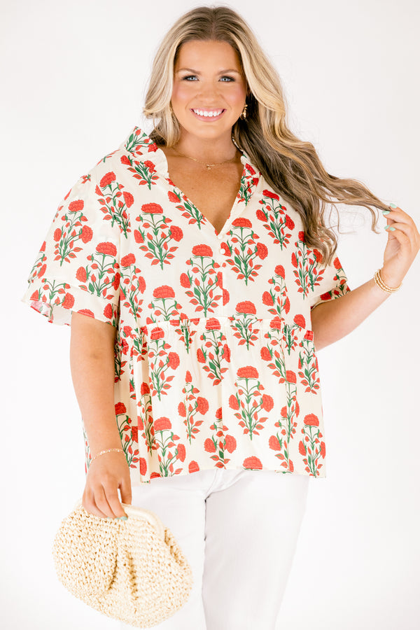 Chic Soul plus size clothing, white top with short sleeves that have a ruffle flare on the ends of the sleeves as well as a slight v-neckline and an abstract orange and green block pattern throughout