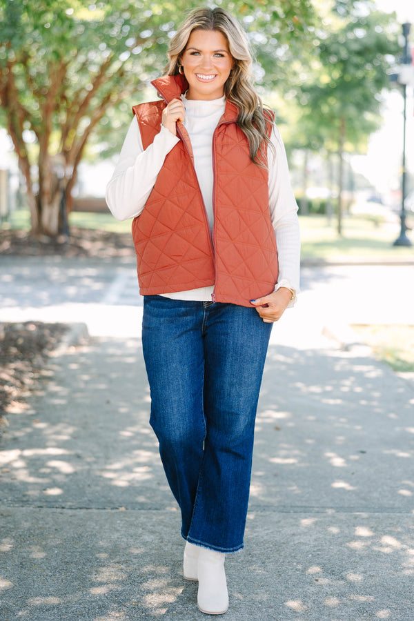 Plus size brown quilted vest with a zip-up front and a cozy, comfortable fit.