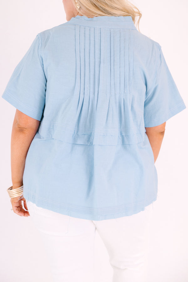 Chic Soul plus size clothing, blue short sleeve top with a v-neckline and an overlay stripe going across the middle of the top 