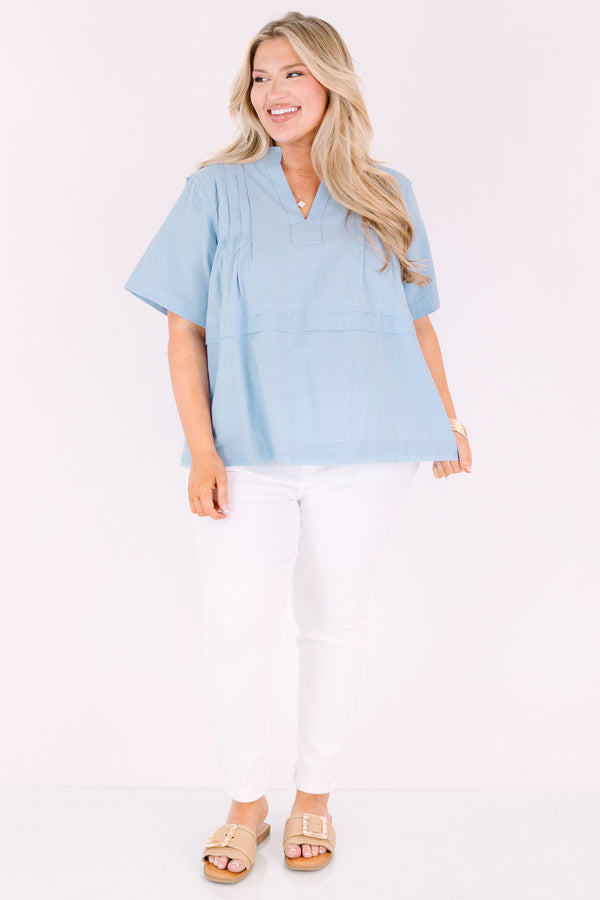 Chic Soul plus size clothing, blue short sleeve top with a v-neckline and an overlay stripe going across the middle of the top 