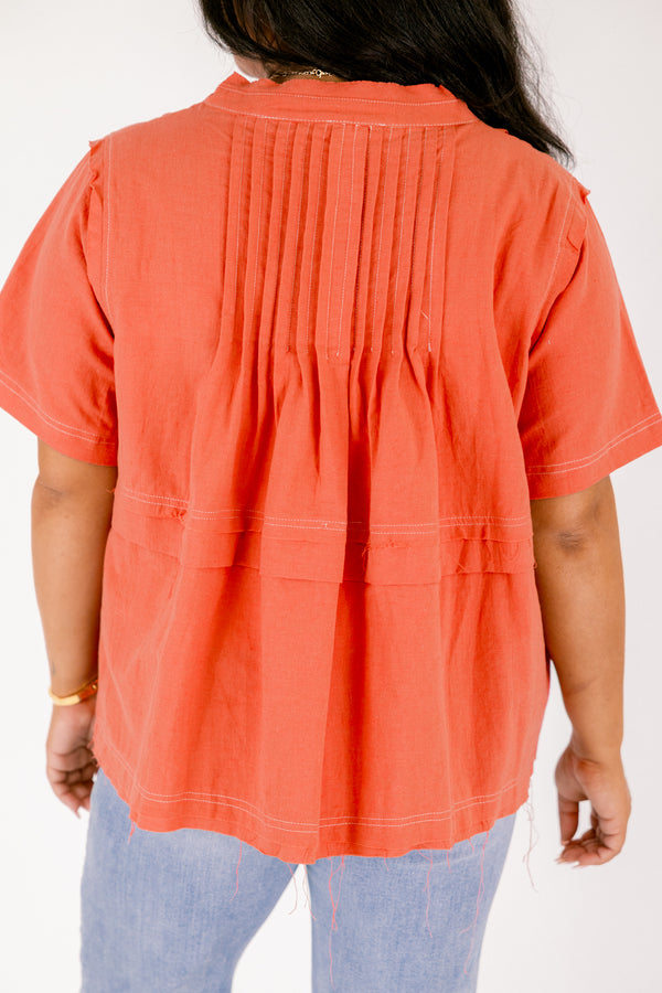 Chic Soul plus size clothing, brick red short sleeve v neck tiered structured top with white stitching detailing