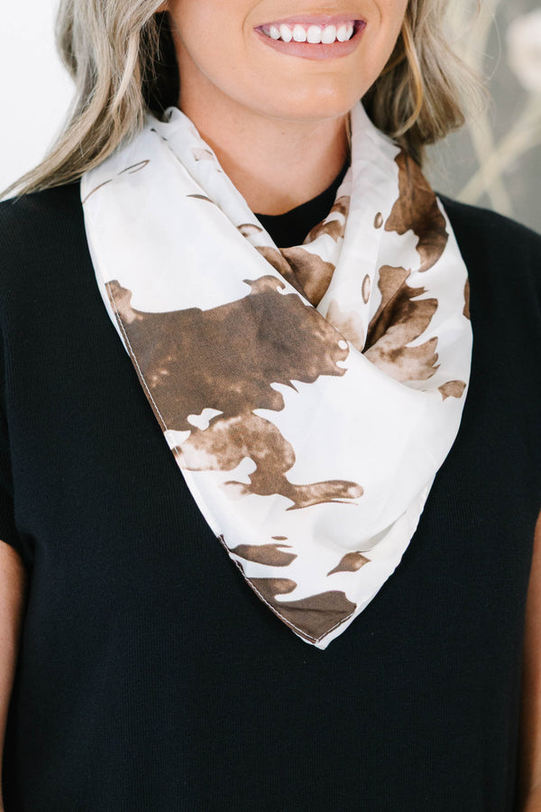 Plus Size Cowgirl Chic Scarf featuring a brown and white cow print pattern in a silky fabric.
