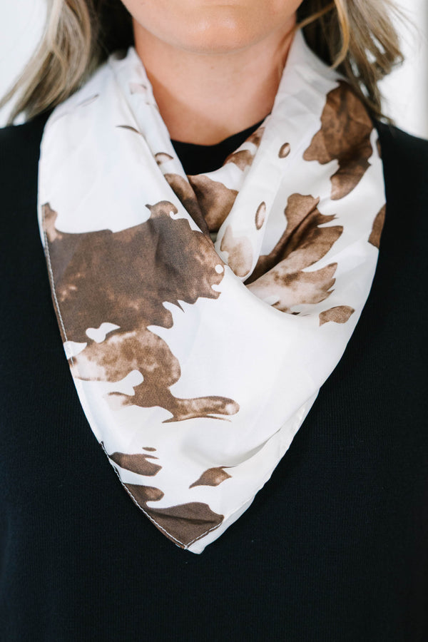 Plus Size Cowgirl Chic Scarf featuring a brown and white cow print pattern in a silky fabric.