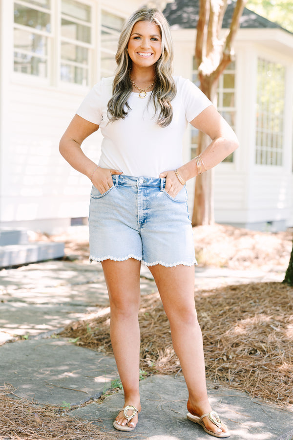 Chic Soul plus size clothing, light wash denim shorts with scalloped hemline and daisy appliques along hem