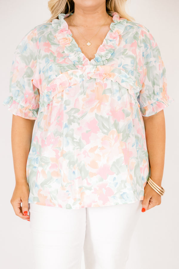 Chic Soul plus size clothing, peach floral top with short sleeves that have a cuffed ruffle detail on the bottom of both sleeves as well as ruffle details outlining the v-neckline and going under the chest area 