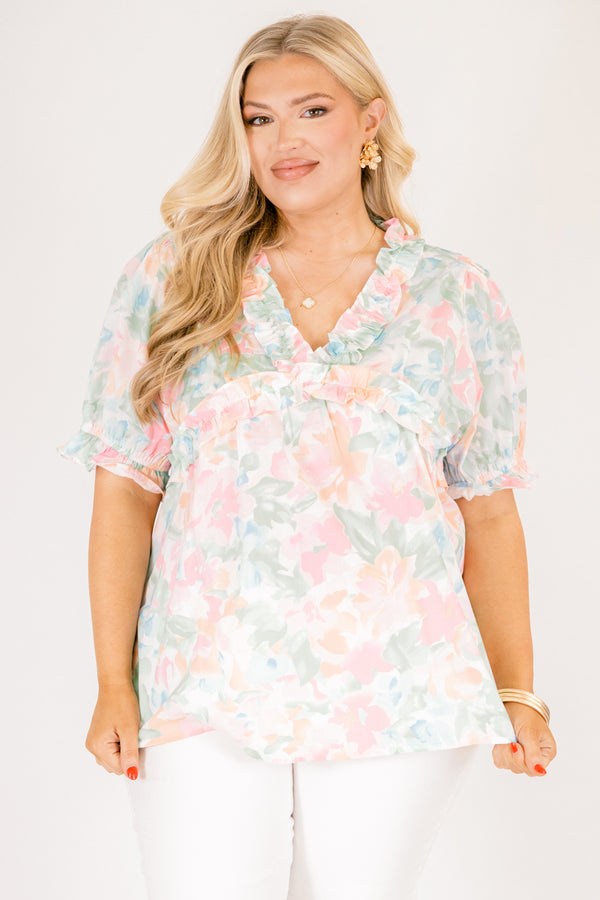 Chic Soul plus size clothing, peach floral top with short sleeves that have a cuffed ruffle detail on the bottom of both sleeves as well as ruffle details outlining the v-neckline and going under the chest area 