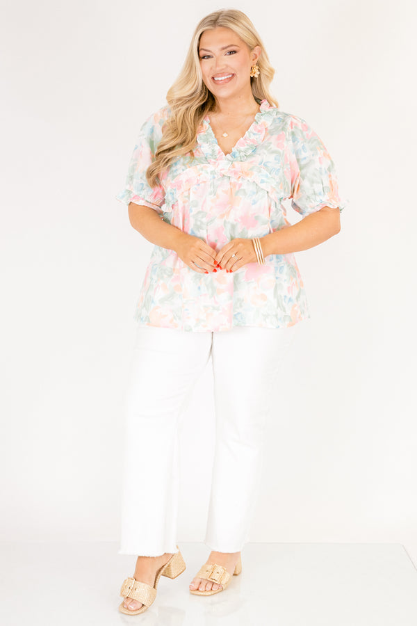 Chic Soul plus size clothing, peach floral top with short sleeves that have a cuffed ruffle detail on the bottom of both sleeves as well as ruffle details outlining the v-neckline and going under the chest area 