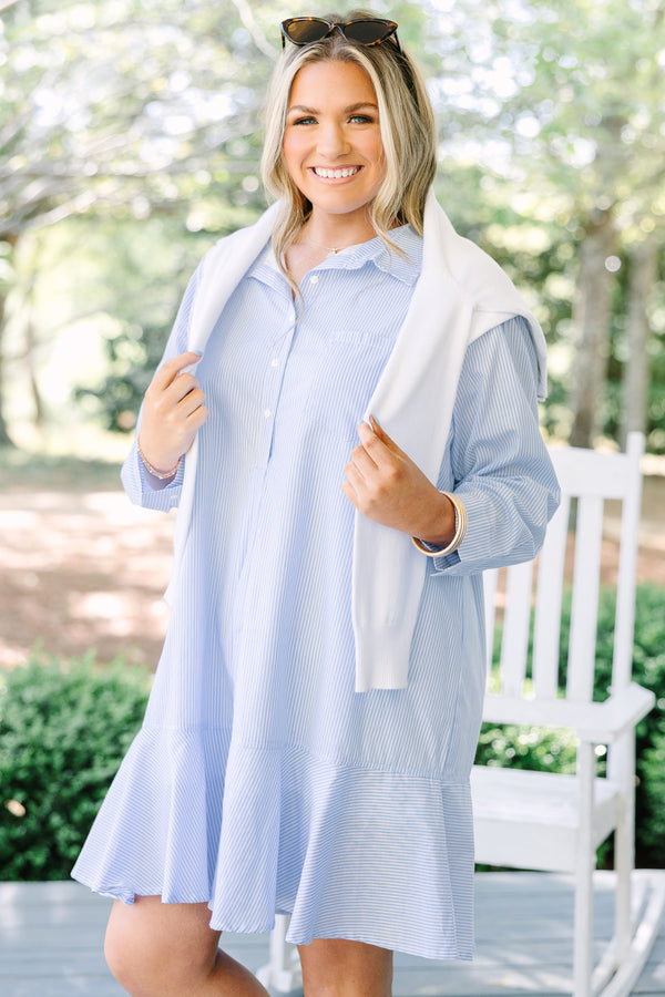 Chic soul plus size clothing, blue striped knee length dress with long sleeves and buttons going down the center of the dress with a ruffle flare at the end 
