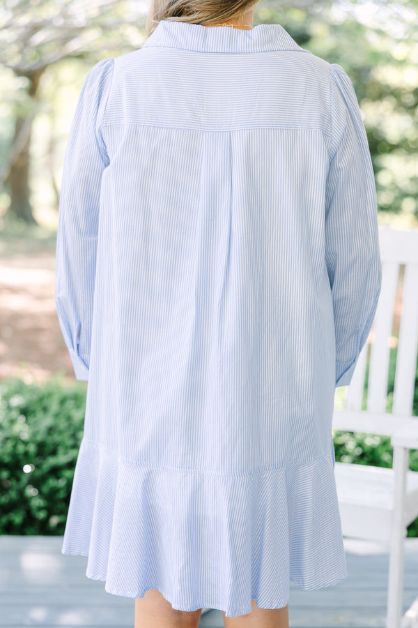 Chic soul plus size clothing, blue striped knee length dress with long sleeves and buttons going down the center of the dress with a ruffle flare at the end 
